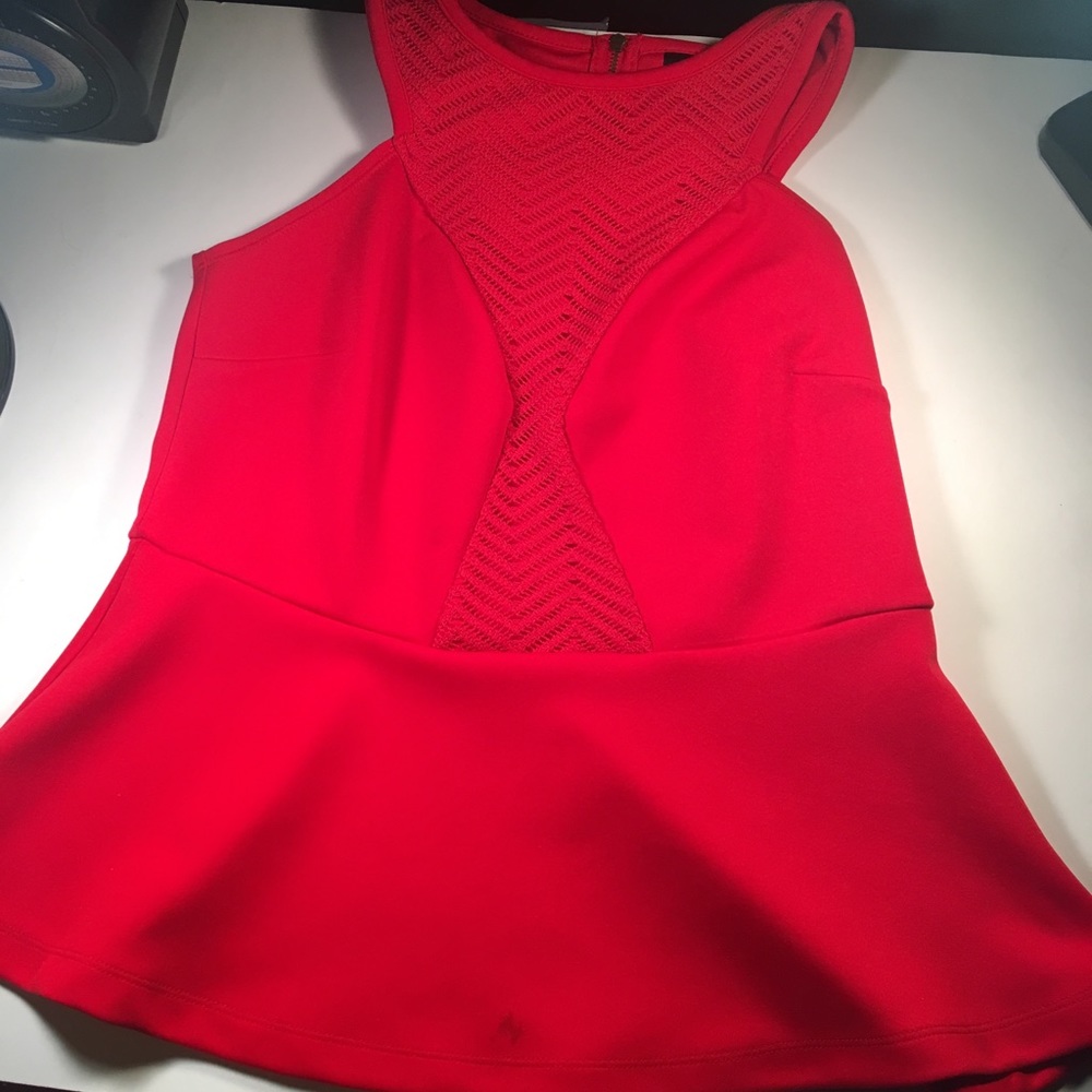 Red, tank top shirt. Has pretty designs on front.